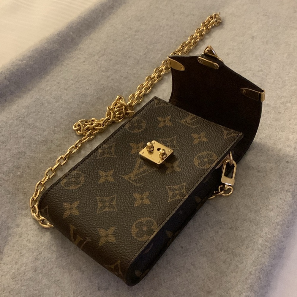 Louis Vuitton monogram authentic new collection small purse with golden chain.